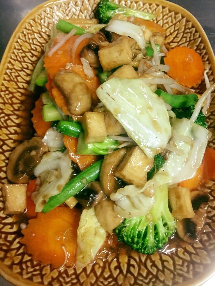 Vegan tofu and vegetable stir-fry with broccoli and mushrooms